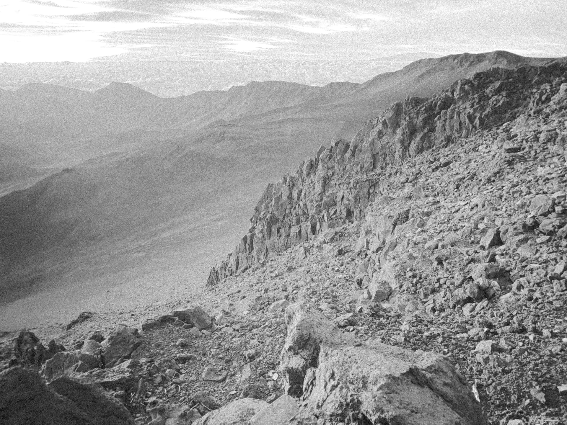 Ridge line above a hazed desert valley